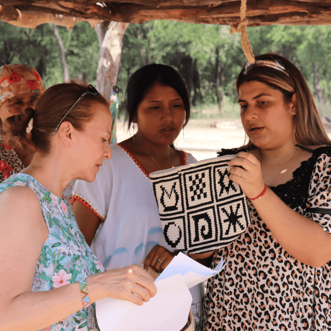 Claudia collaborating with a Wayuu artisan on a custom wholesale design, honoring tradition and craftsmanship.