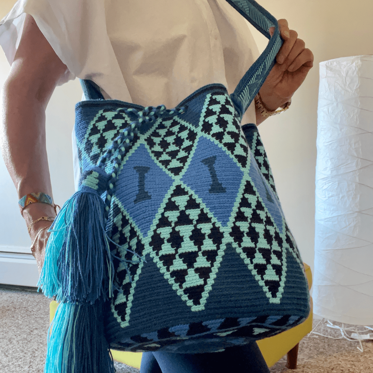 Flora Wayuu bags showcasing a range of blue shades and distinctive diamond patterns.
