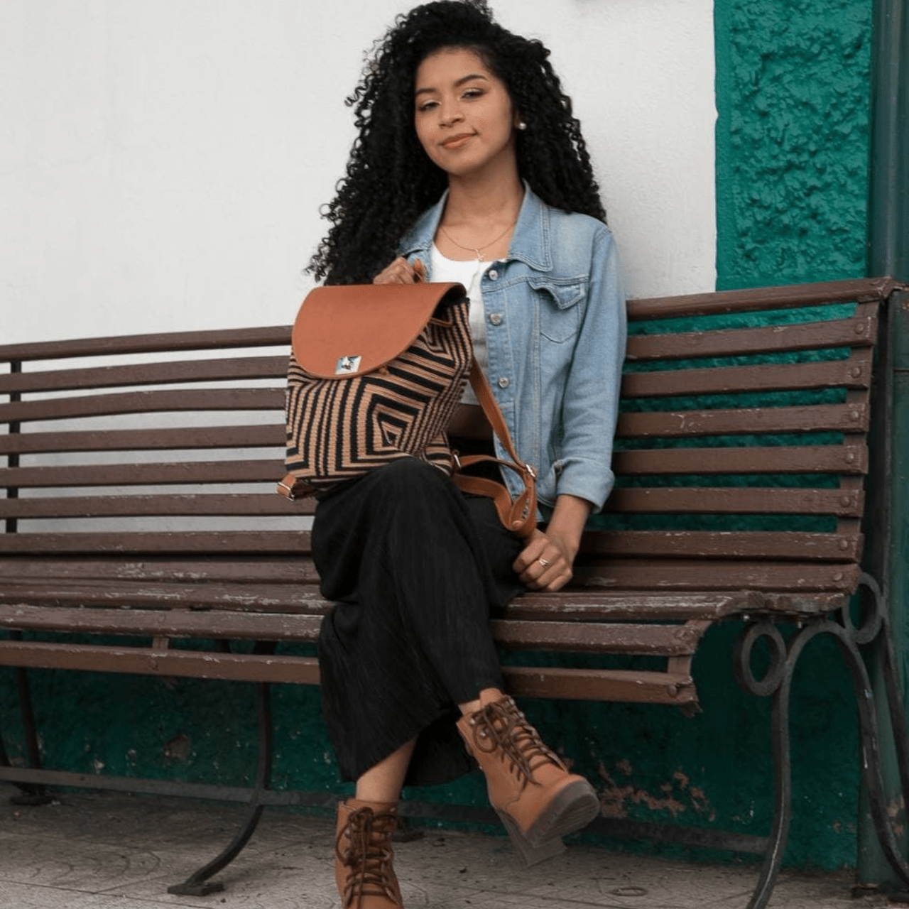 A stylish and durable Minca backpack featuring a unique combination of Wayuu body design and genuine leather accents.