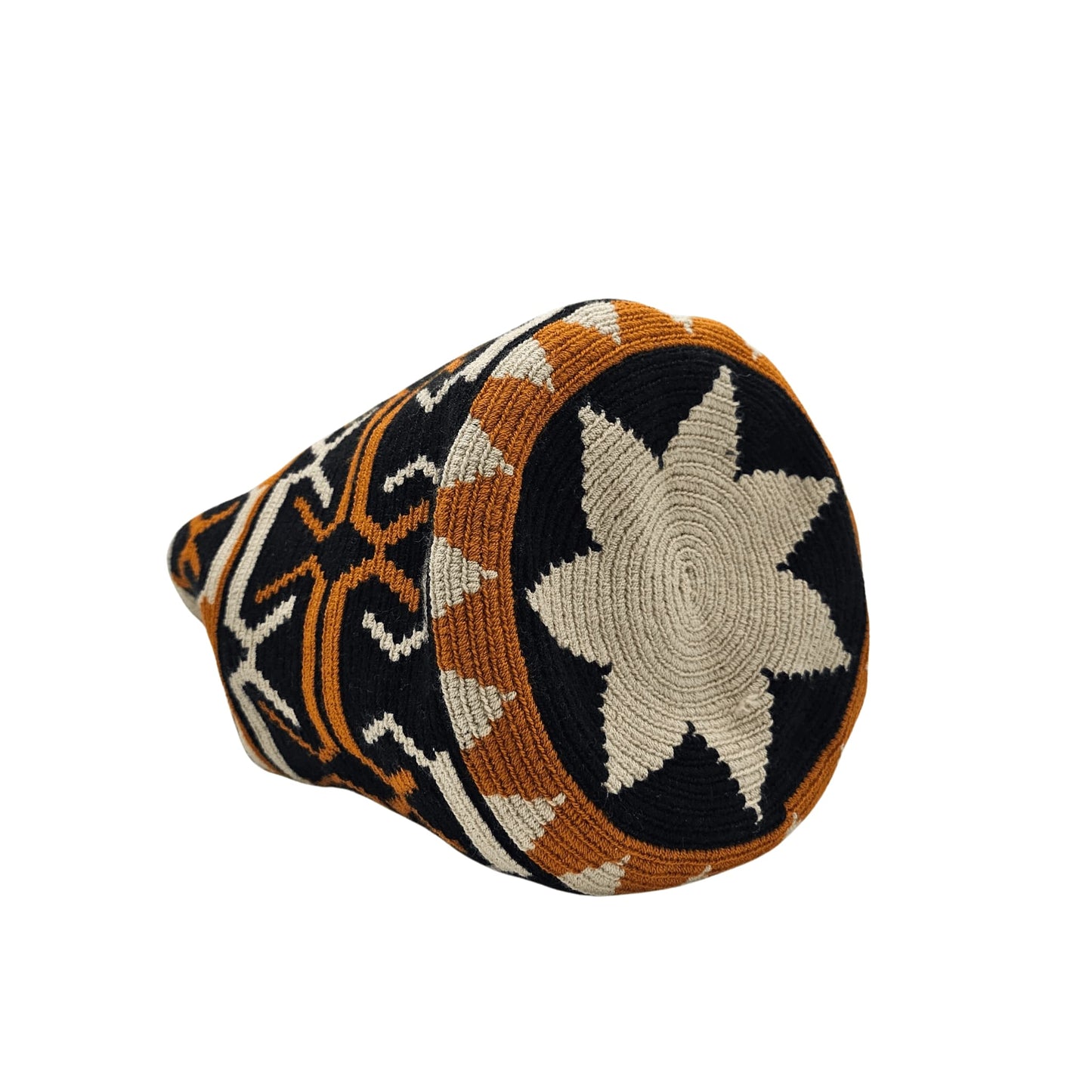 A handmade Wayuu Mochila bag from Colombia, featuring a striking geometric design and a drawstring closure with tassels.