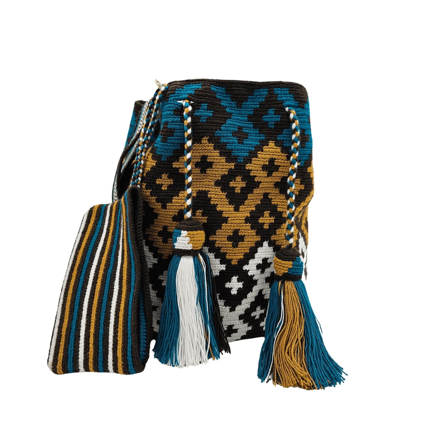 A handmade Wayuu mochila bag with an intricate geometric pattern in black, white, mustard yellow, and teal blue. The cylindrical bag has a woven shoulder strap and a drawstring closure adorned with matching tassels.