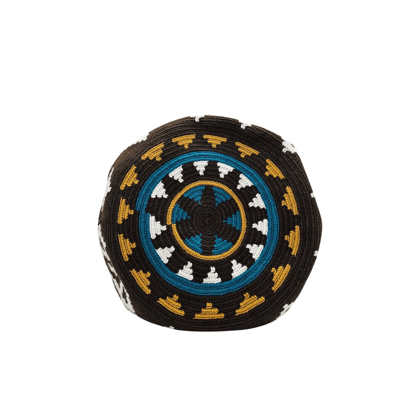 A handmade Wayuu mochila bag with an intricate geometric pattern in black, white, mustard yellow, and teal blue. The cylindrical bag has a woven shoulder strap and a drawstring closure adorned with matching tassels.