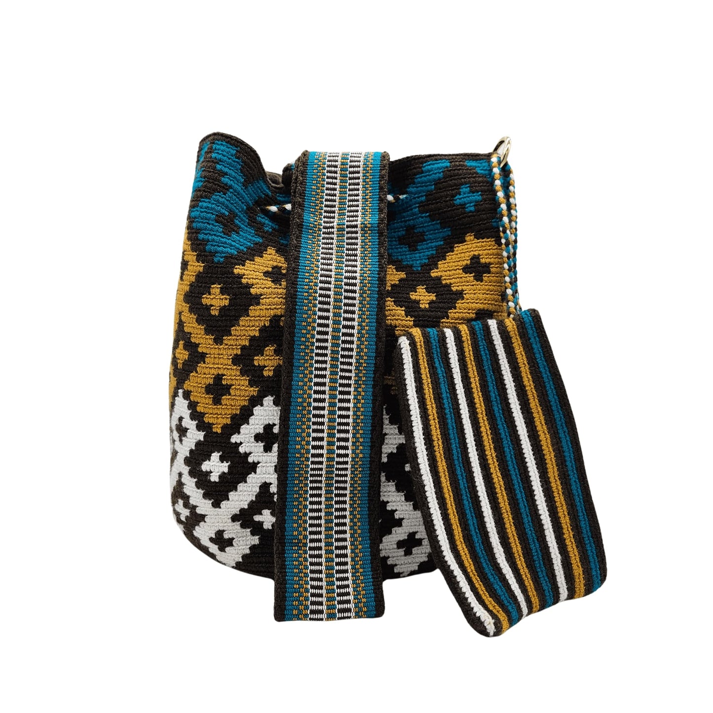 A handmade Wayuu mochila bag with an intricate geometric pattern in black, white, mustard yellow, and teal blue. The cylindrical bag has a woven shoulder strap and a drawstring closure adorned with matching tassels.