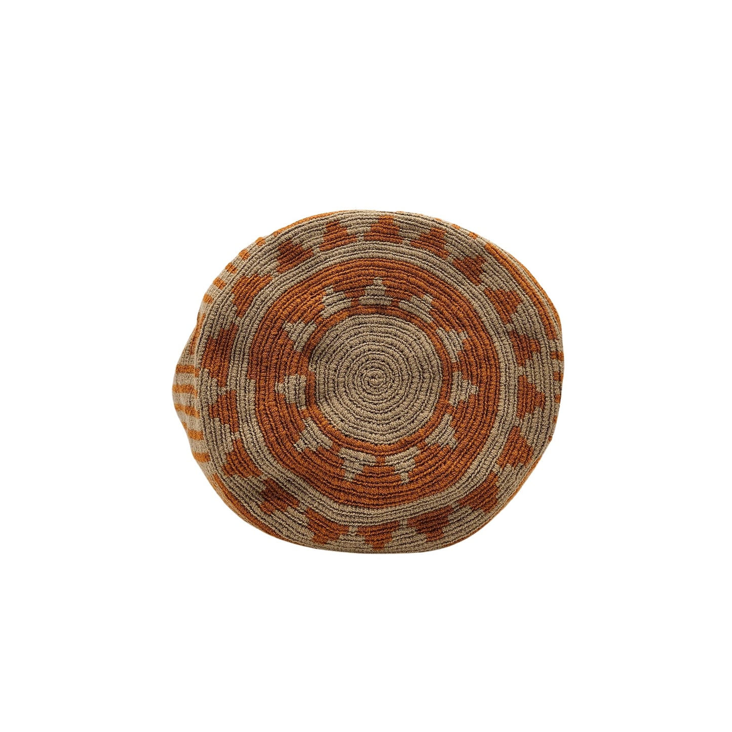 A Wayuu bag with a rusty orange background and a woven geometric pattern in beige. The bag has a drawstring closure with long tassels.