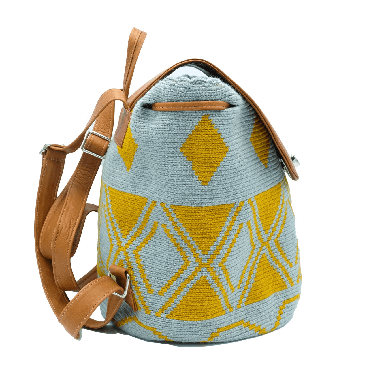Taganga leather backpack featuring a stunning Wayuu pattern in a captivating blend of blue-gray and ochre colors. The design is accentuated with natural genuine leather, creating a beautiful contrast. This versatile bag is perfect for day outings or short trips, offering a lightweight and comfortable carrying experience.
