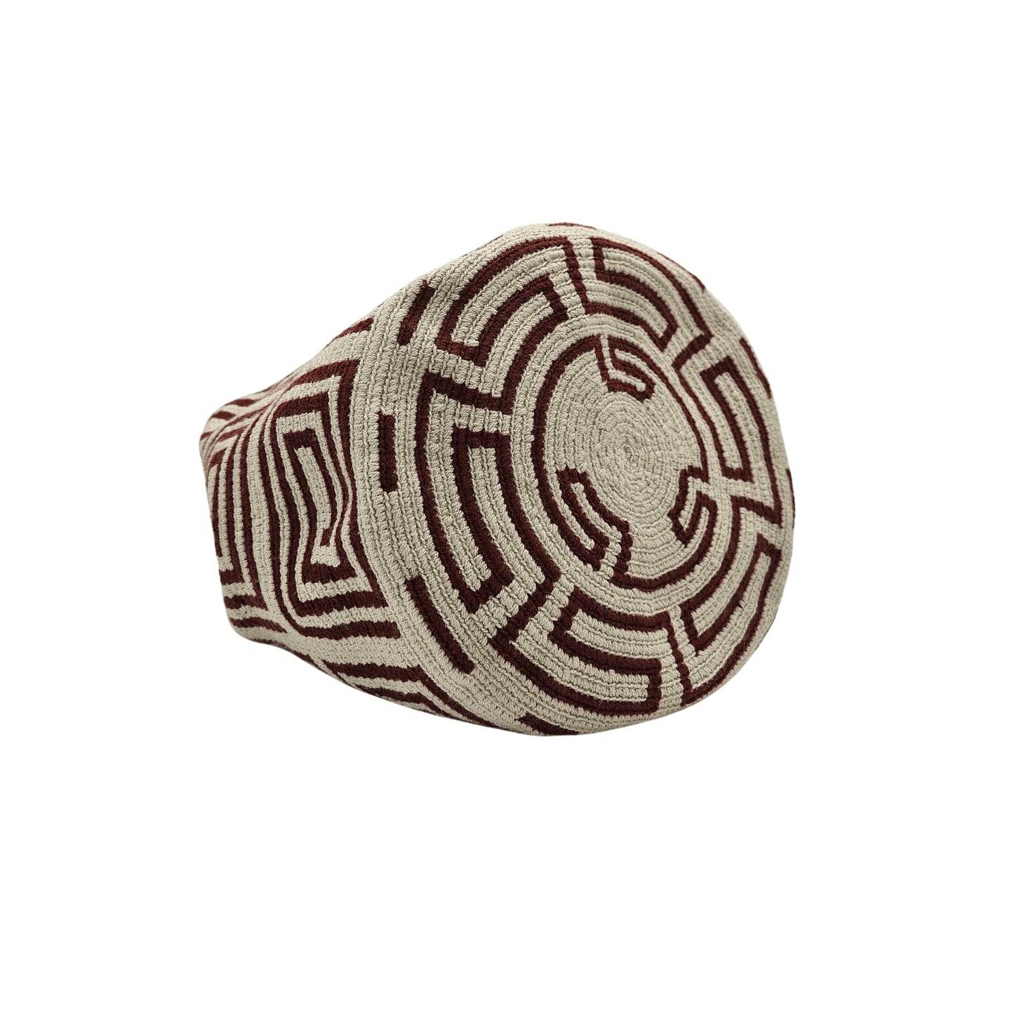 A beige Wayuu Mochila bag with a brown geometric pattern. It has a drawstring closure with tassels.