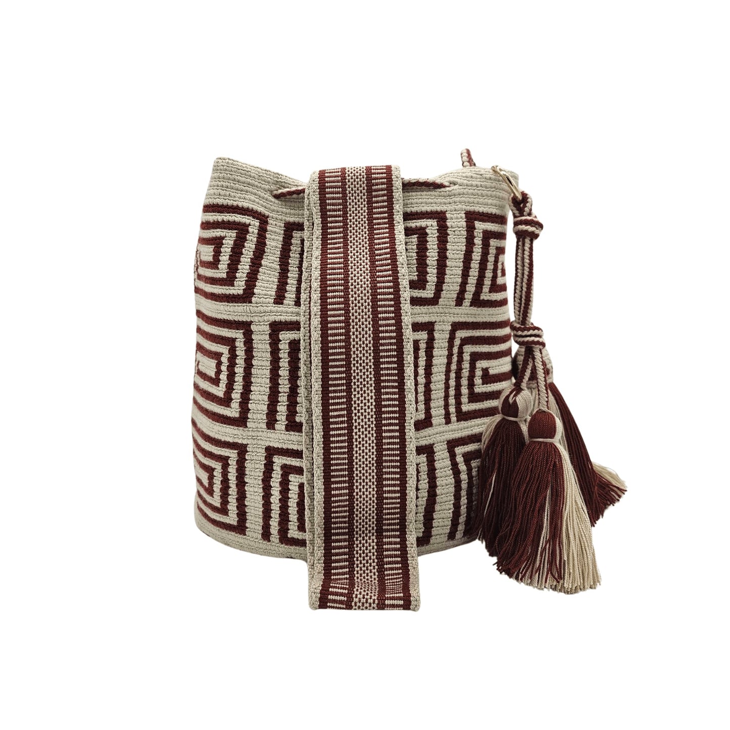 A beige Wayuu Mochila bag with a brown geometric pattern. It has a drawstring closure with tassels.