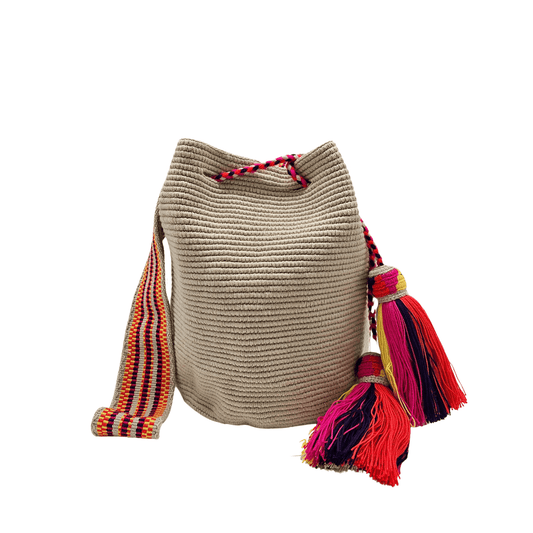 Solid beige Wayuu bag with colorful macrame strap, perfect for everyday use by Origin Colombia.
