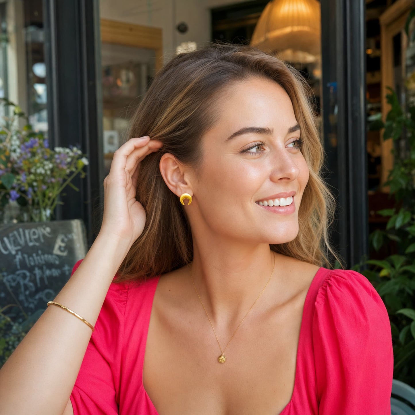 Barú Dainty Gold Stud Earrings, handmade Colombian gold jewelry, simple crescent design in studio shot