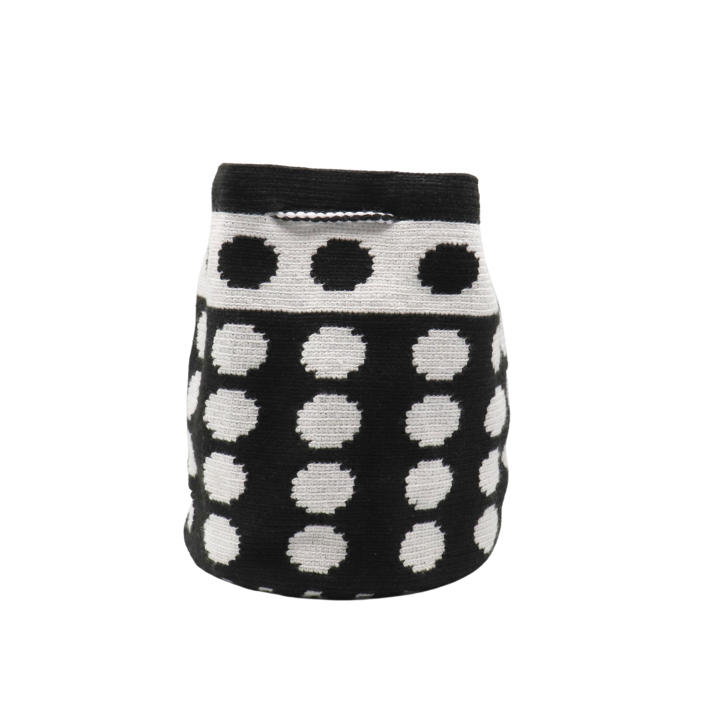 Black and white handmade Wayuu bag with dotted pattern and striped strap.