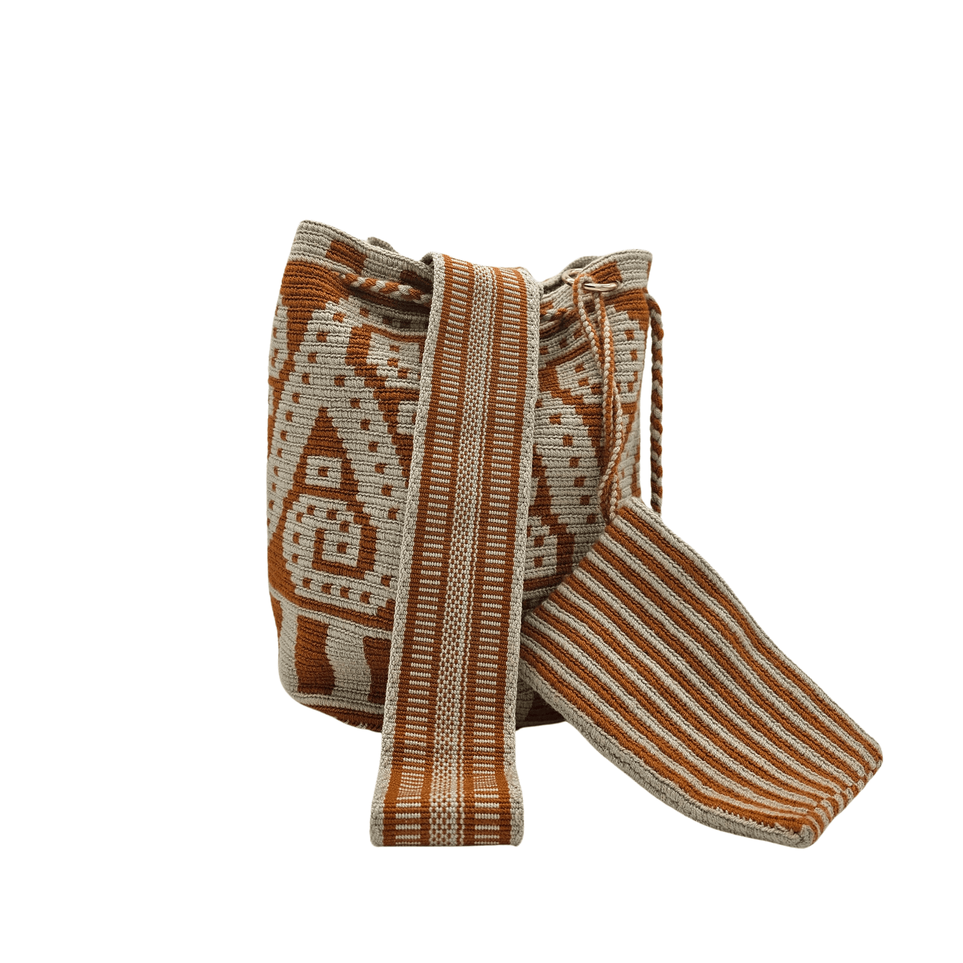 A Wayuu bag with a brown background and intricate woven patterns in a lighter beige color. The bag has a drawstring closure with long tassels.
