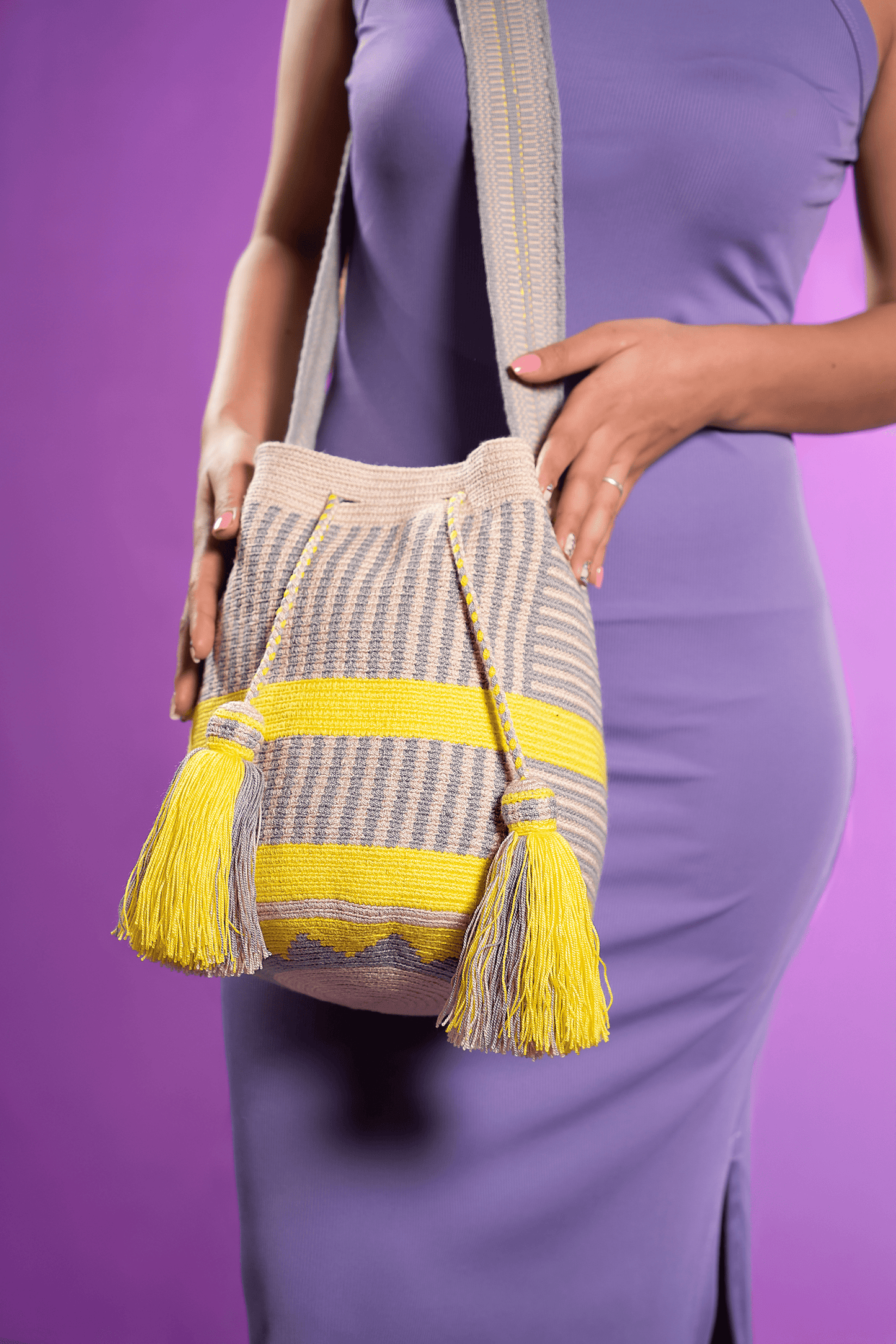 Vibrant, handwoven Wayuu beach bag, showcasing intricate patterns and bold colors, crafted with care and tradition by Origin Colombia