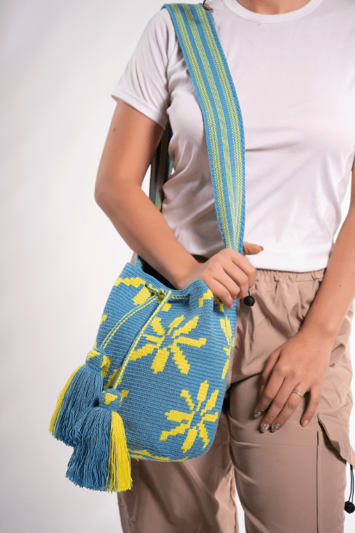 Handmade Wayuu bag by Wayuu artisans, this unique bag in cobalt blue and yellow with a flowers design is perfect for everyday use.