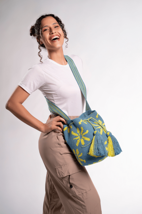 Handmade Wayuu bag by Wayuu artisans, this unique bag in cobalt blue and yellow with a flowers design is perfect for everyday use.