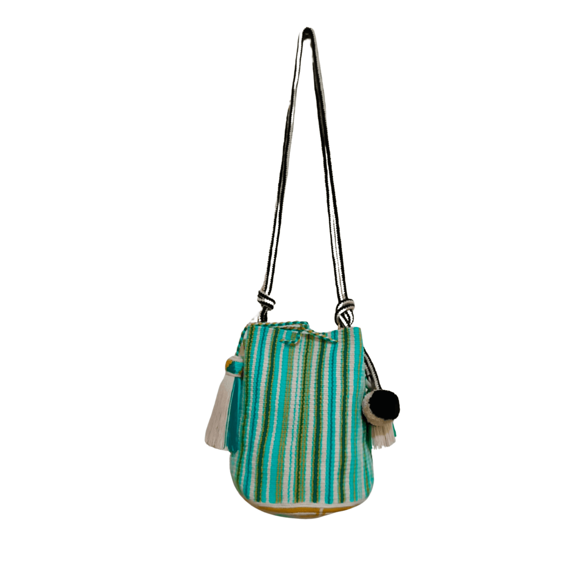 A handcrafted Wayuu bag with a vibrant striped pattern in turquoise, white, and yellow. The bag features a single long, braided black-and-white shoulder strap, a drawstring closure, and decorative tassels with a black pompoms accent.