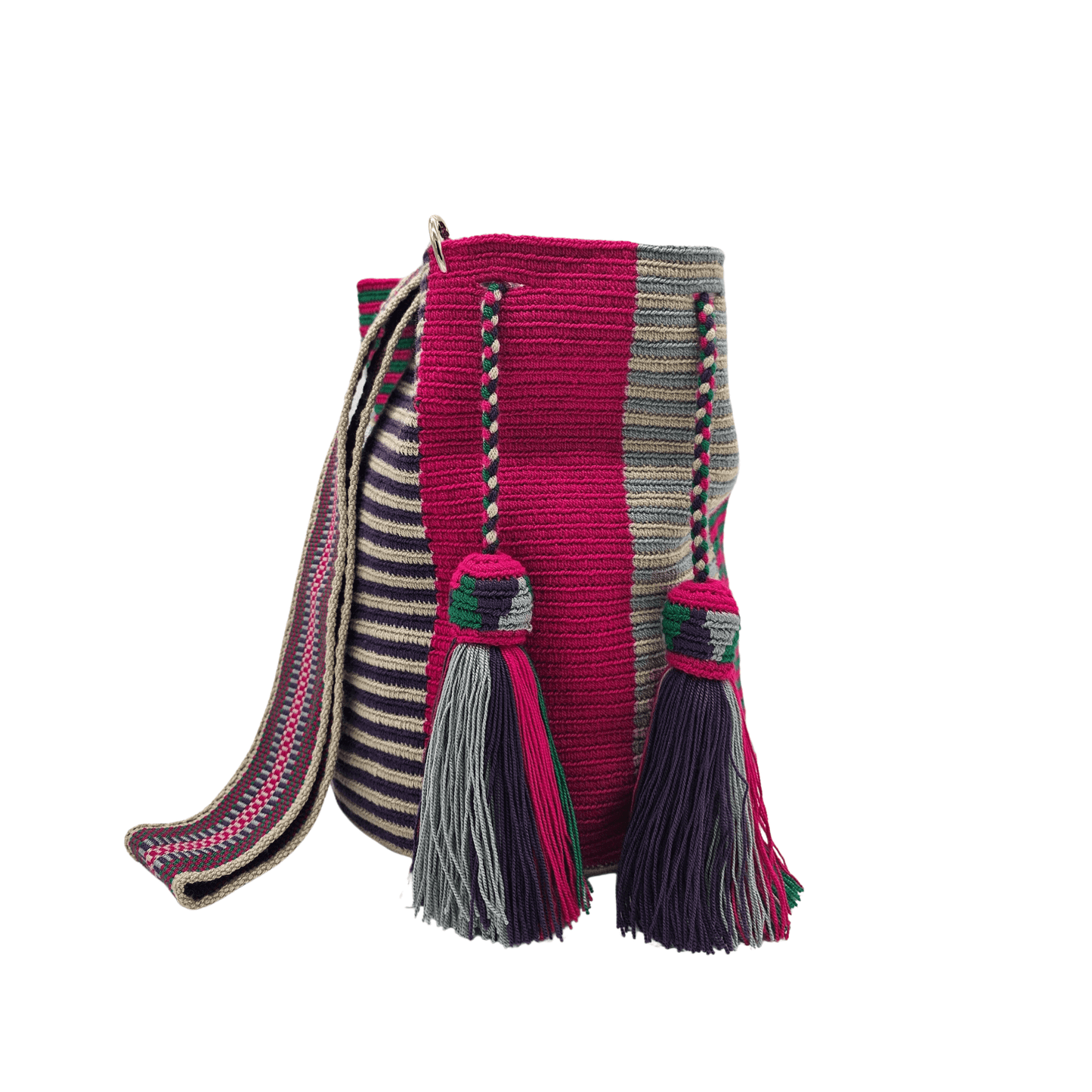 A Wayuu Mochila bag with a pink, purple, and beige striped pattern. It has a drawstring closure with tassels and includes a small matching pouch.