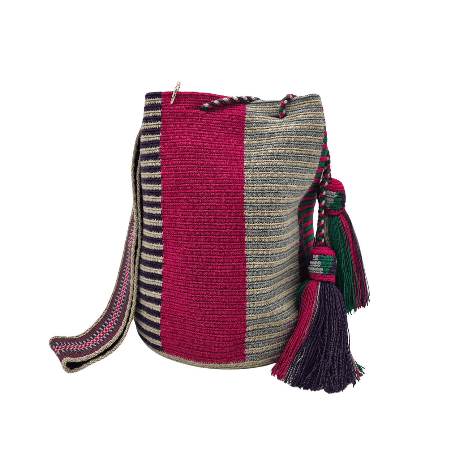 A Wayuu Mochila bag with a pink, purple, and beige striped pattern. It has a drawstring closure with tassels and includes a small matching pouch.