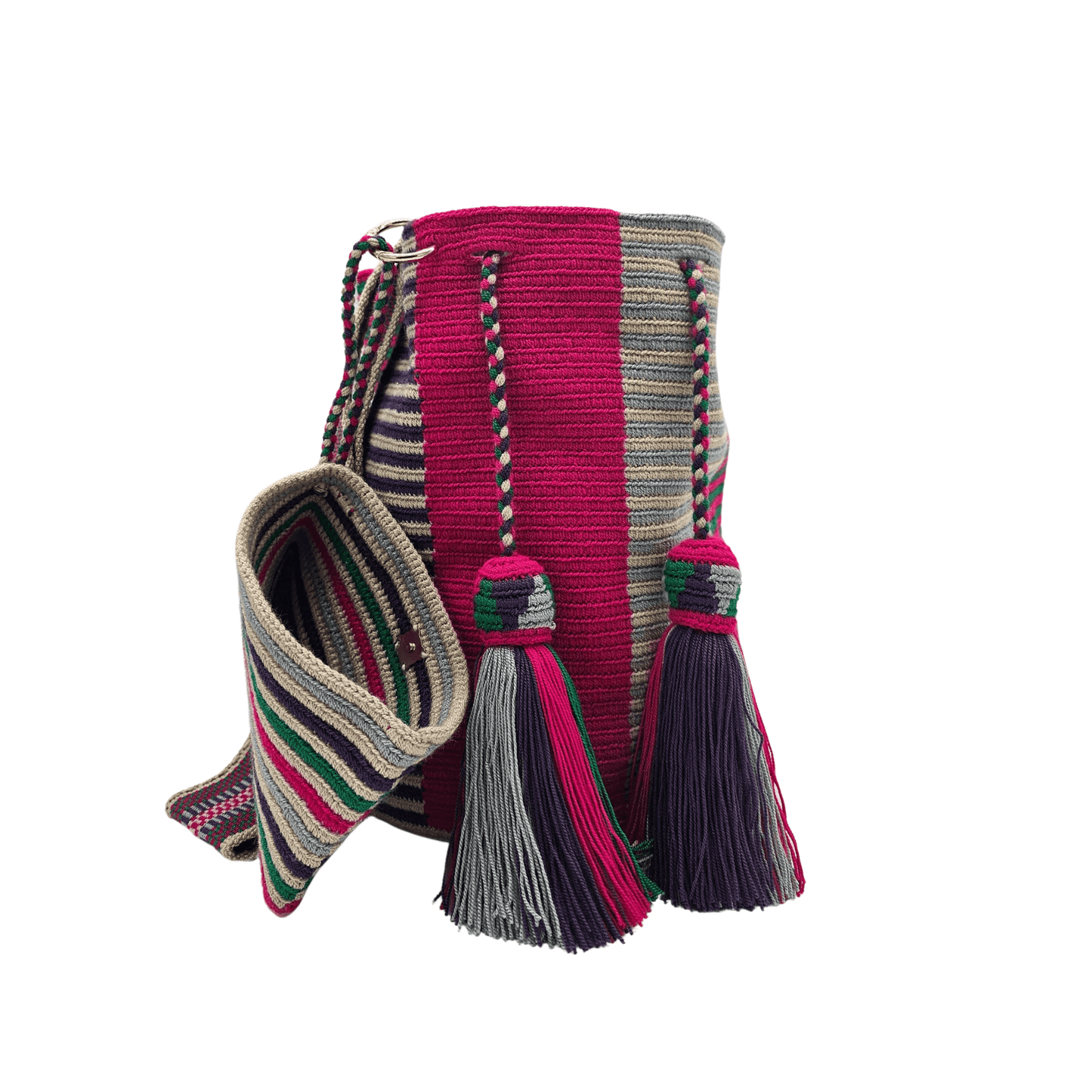 A Wayuu Mochila bag with a pink, purple, and beige striped pattern. It has a drawstring closure with tassels and includes a small matching pouch.