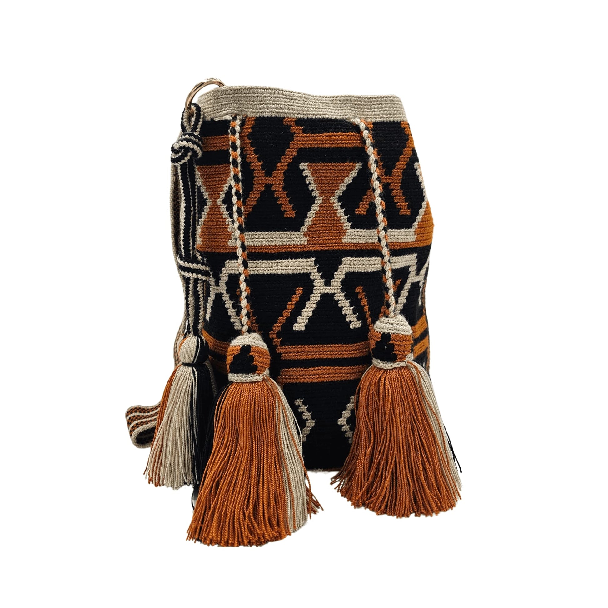 A handmade Wayuu Mochila bag from Colombia, featuring a striking geometric design and a drawstring closure with tassels.