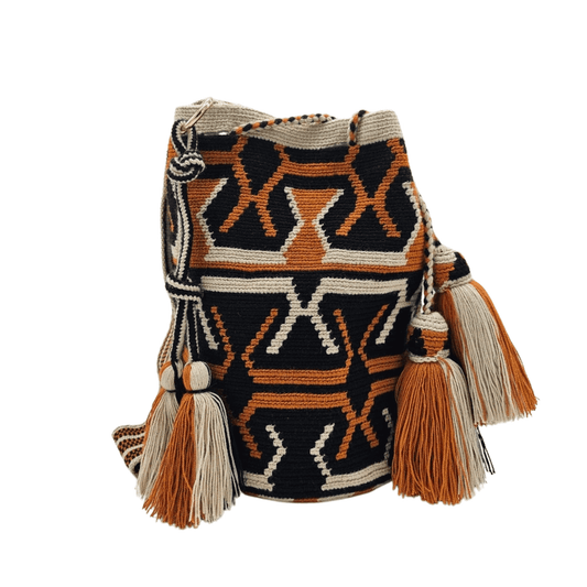 A handmade Wayuu Mochila bag from Colombia, featuring a striking geometric design and a drawstring closure with tassels.