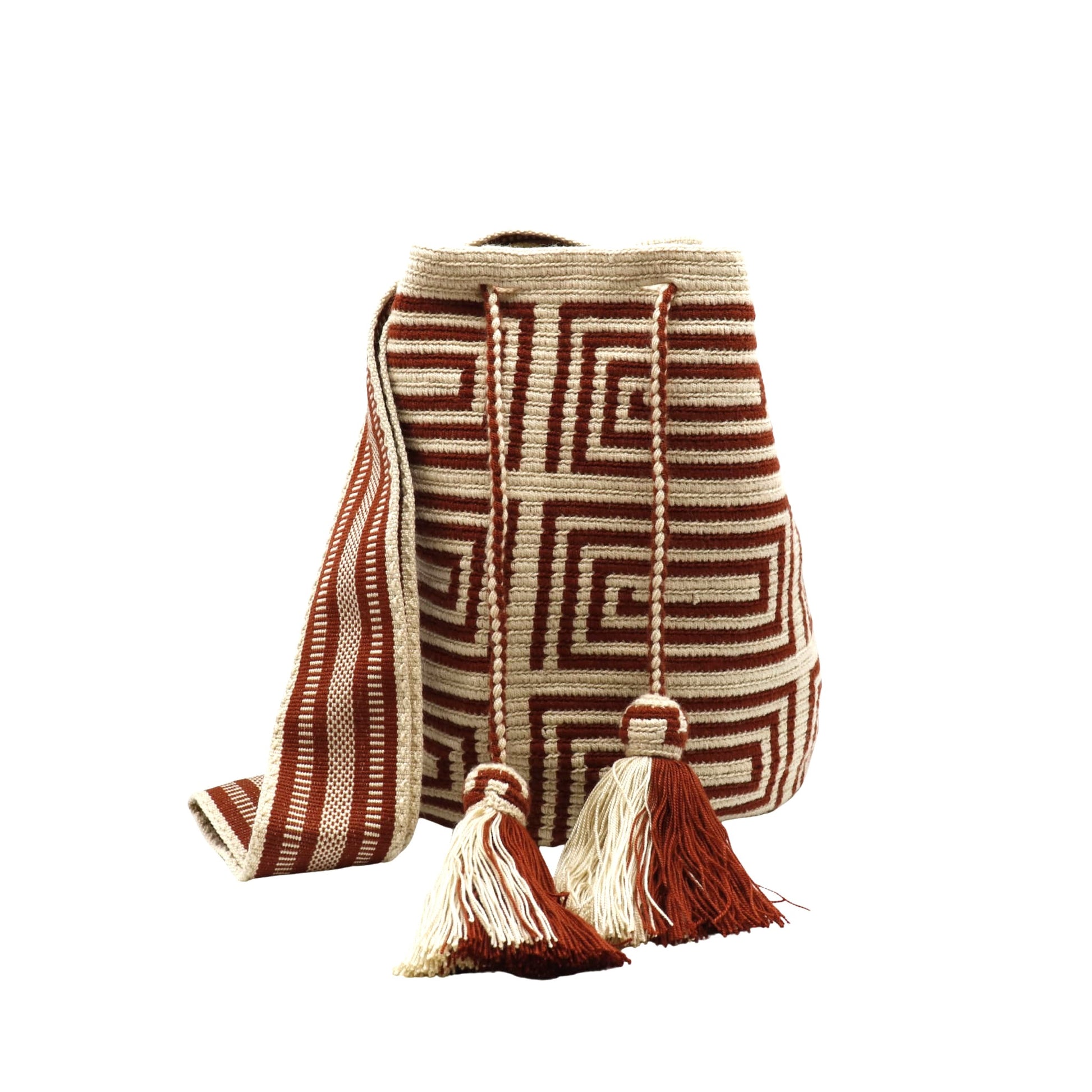 A beige Wayuu Mochila bag with a brown geometric pattern. It has a drawstring closure with tassels.