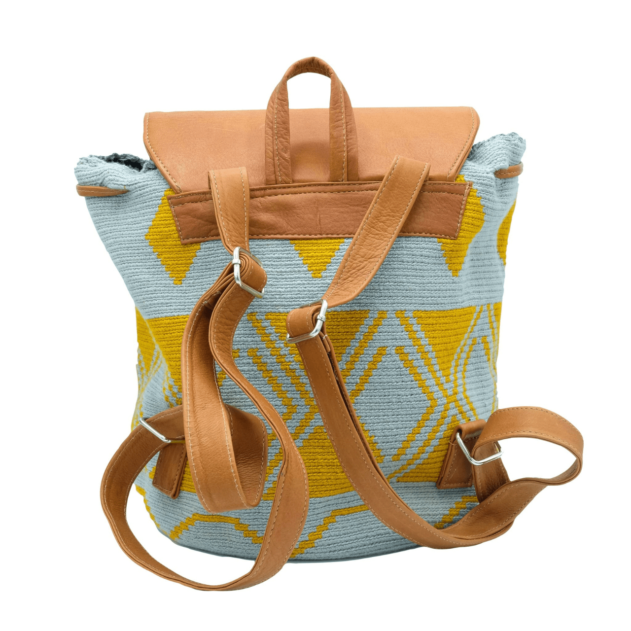 Taganga leather backpack featuring a stunning Wayuu pattern in a captivating blend of blue-gray and ochre colors. The design is accentuated with natural genuine leather, creating a beautiful contrast. This versatile bag is perfect for day outings or short trips, offering a lightweight and comfortable carrying experience.