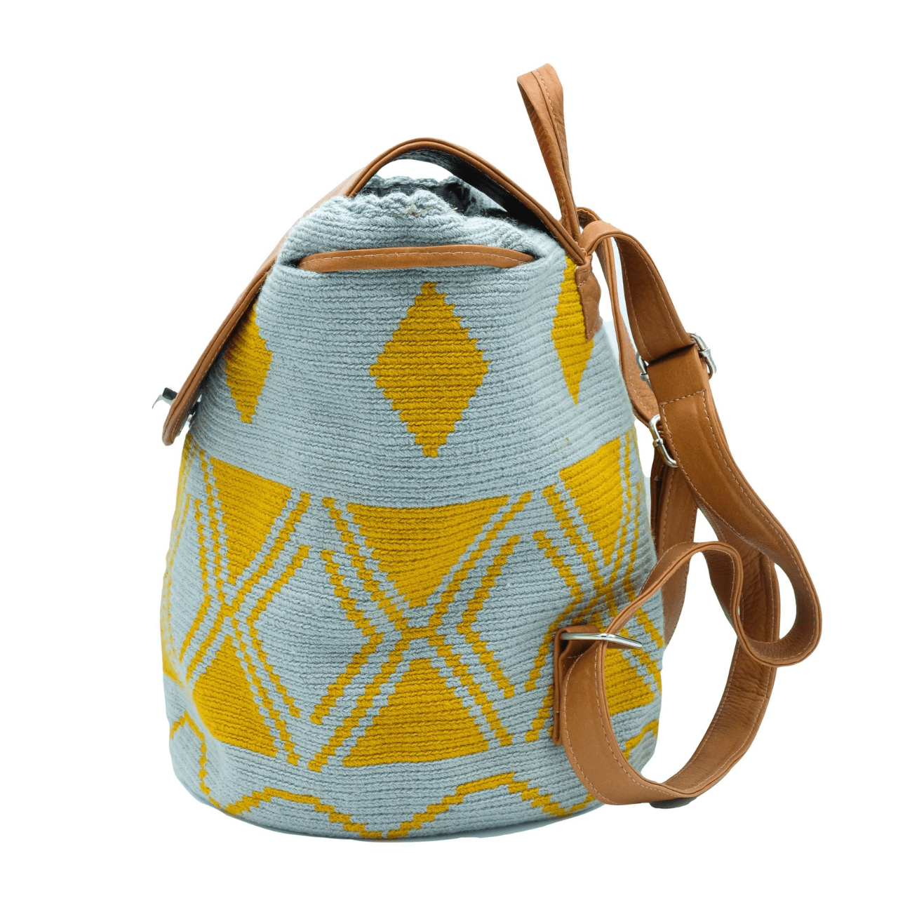 Taganga leather backpack featuring a stunning Wayuu pattern in a captivating blend of blue-gray and ochre colors. The design is accentuated with natural genuine leather, creating a beautiful contrast. This versatile bag is perfect for day outings or short trips, offering a lightweight and comfortable carrying experience.
