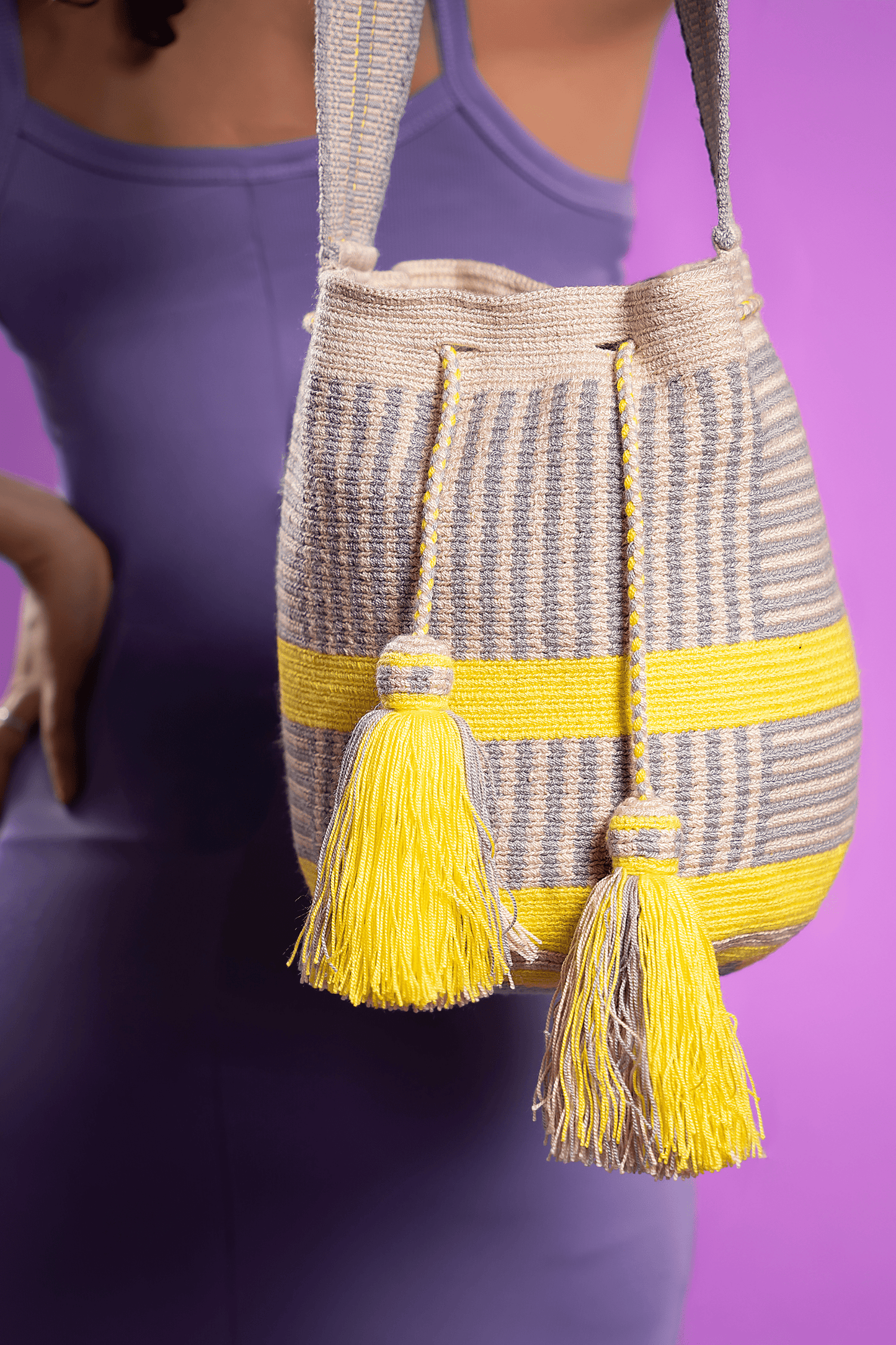 Vibrant, handwoven Wayuu beach bag, showcasing intricate patterns and bold colors, crafted with care and tradition by Origin Colombia