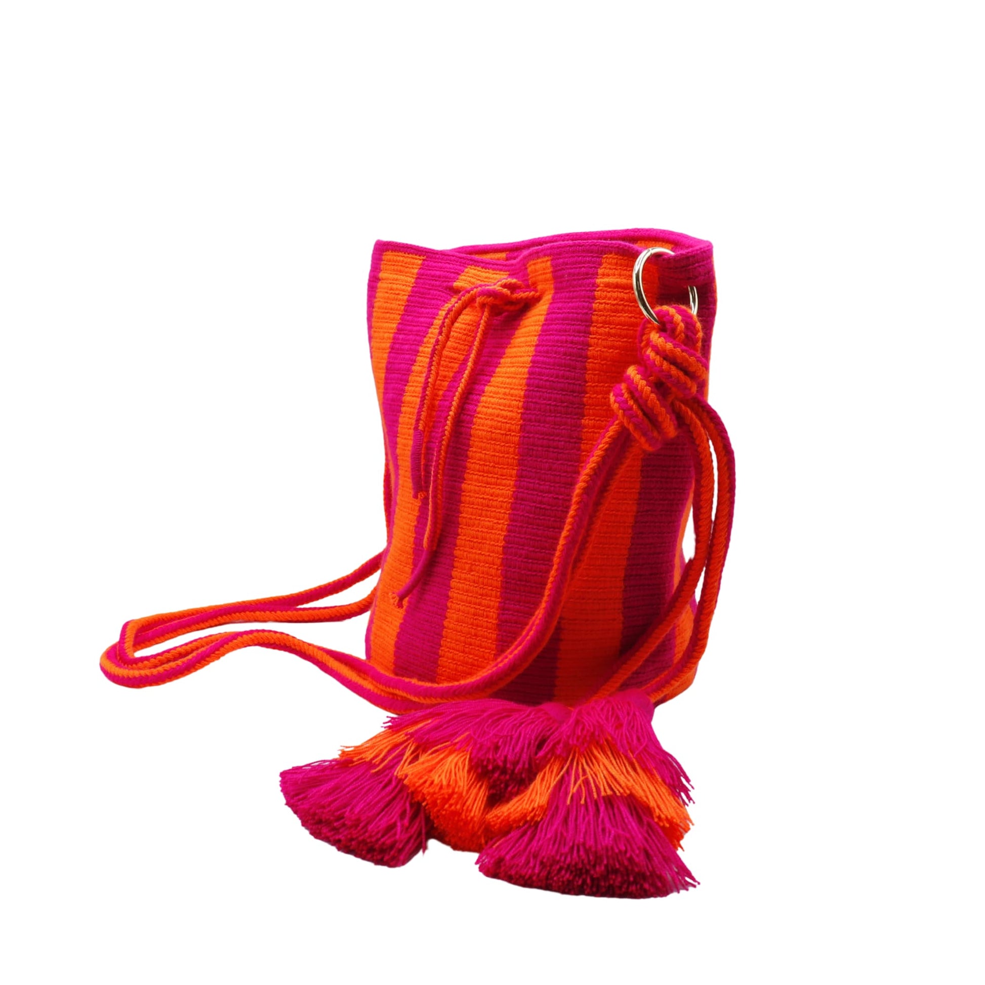 Handmade Wayuu bag with vibrant pink and orange stripes, long woven cord strap, and tassel detail.