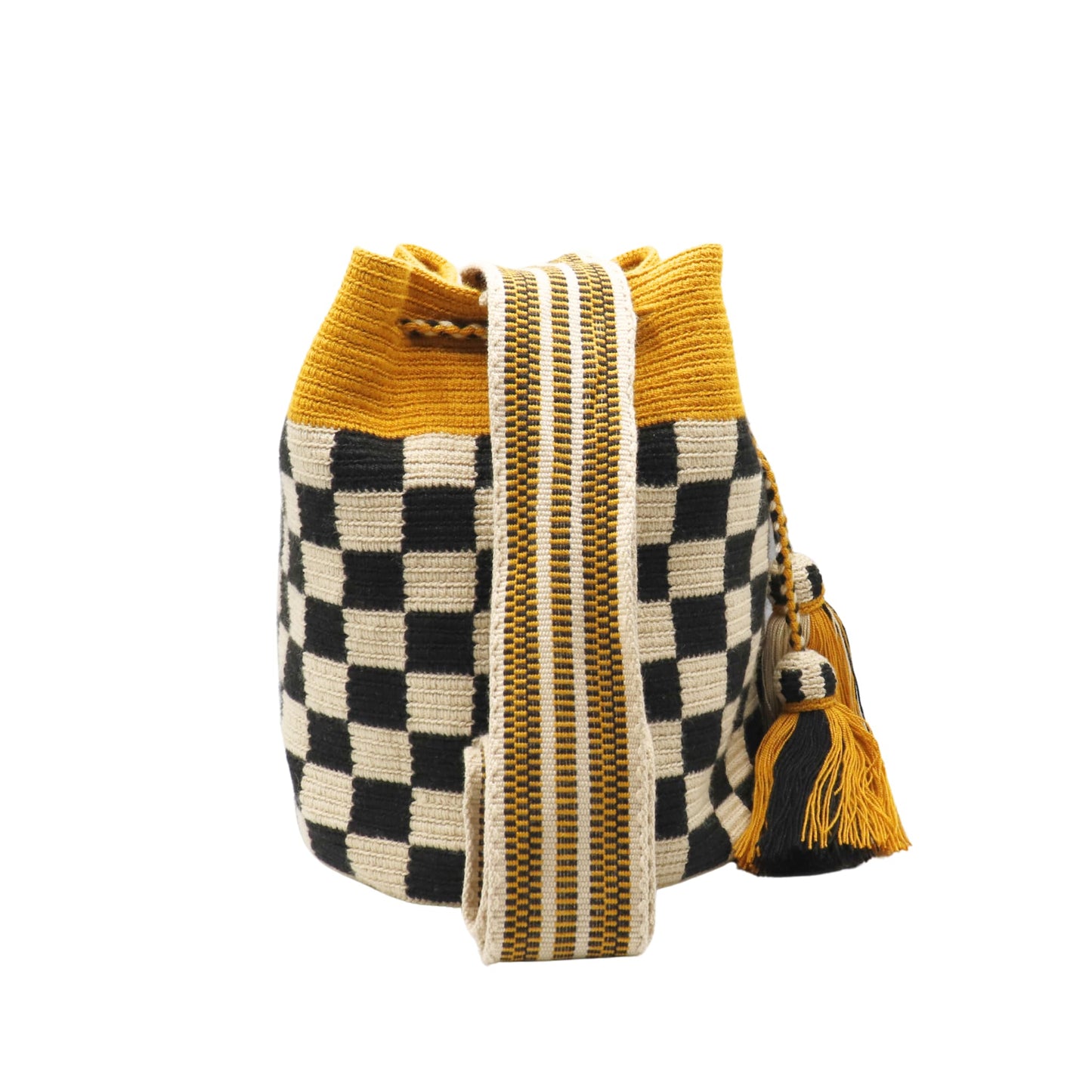 Handmade Wayuu bag with mustard, beige, and black colors, featuring a checkerboard pattern, striped woven strap, and tassel detail.