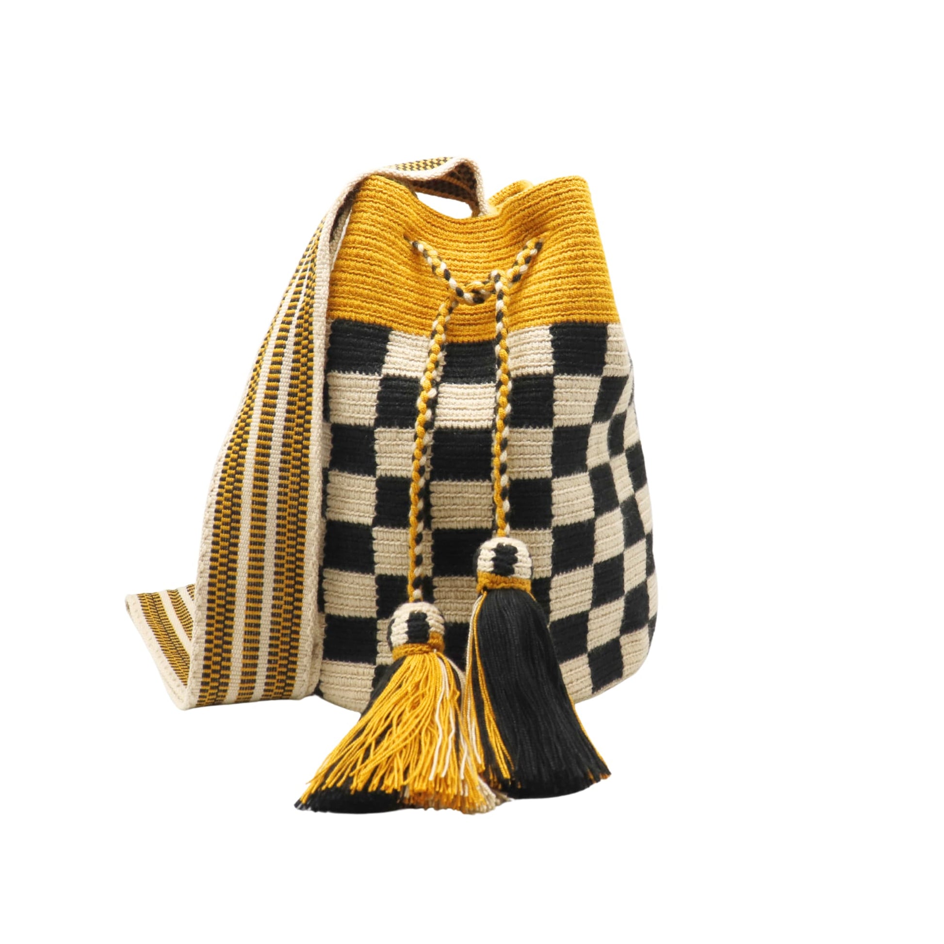 Handmade Wayuu bag with mustard, beige, and black colors, featuring a checkerboard pattern, striped woven strap, and tassel detail.
