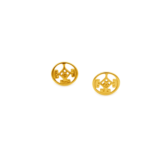 24K gold-plated pewter stud earrings on a model in a natural outdoor setting