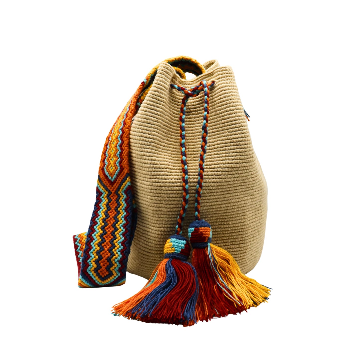 Beige handmade Wayuu bucket bag with a wide multicolored macramé strap featuring orange, yellow, aqua blue, navy, and red geometric patterns. The bag has a textured crochet body, braided drawstring closure, and large colorful tassels.